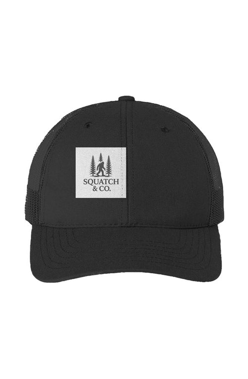 The Bigfoot Trucker — Squatch & Co. five-panel trucker cap with woven Squatch & Co. patch